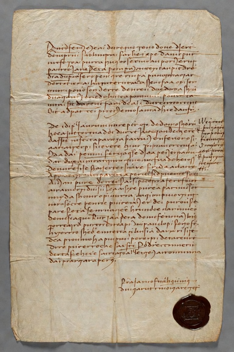 A Venetian charter, folded and sealed: two columns of notarial hand in iron-gall ink on skin, the wax seal still attached at the foot.